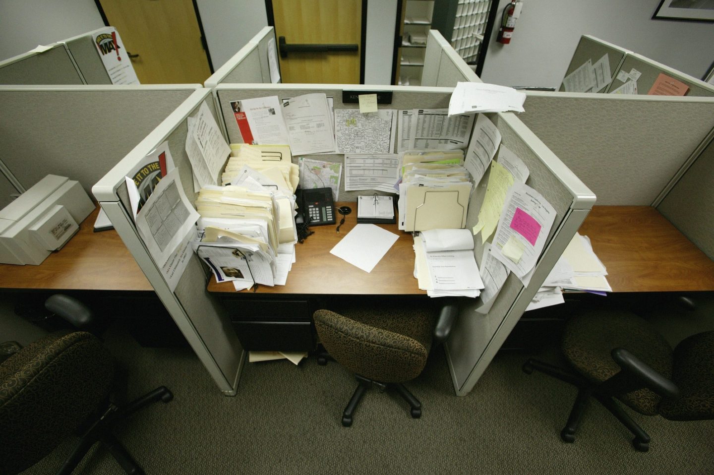 Empty office cubicles.