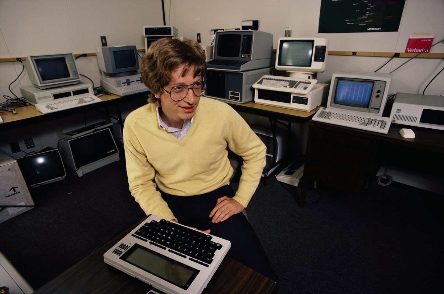 Young Bill Gates surrounded by computers