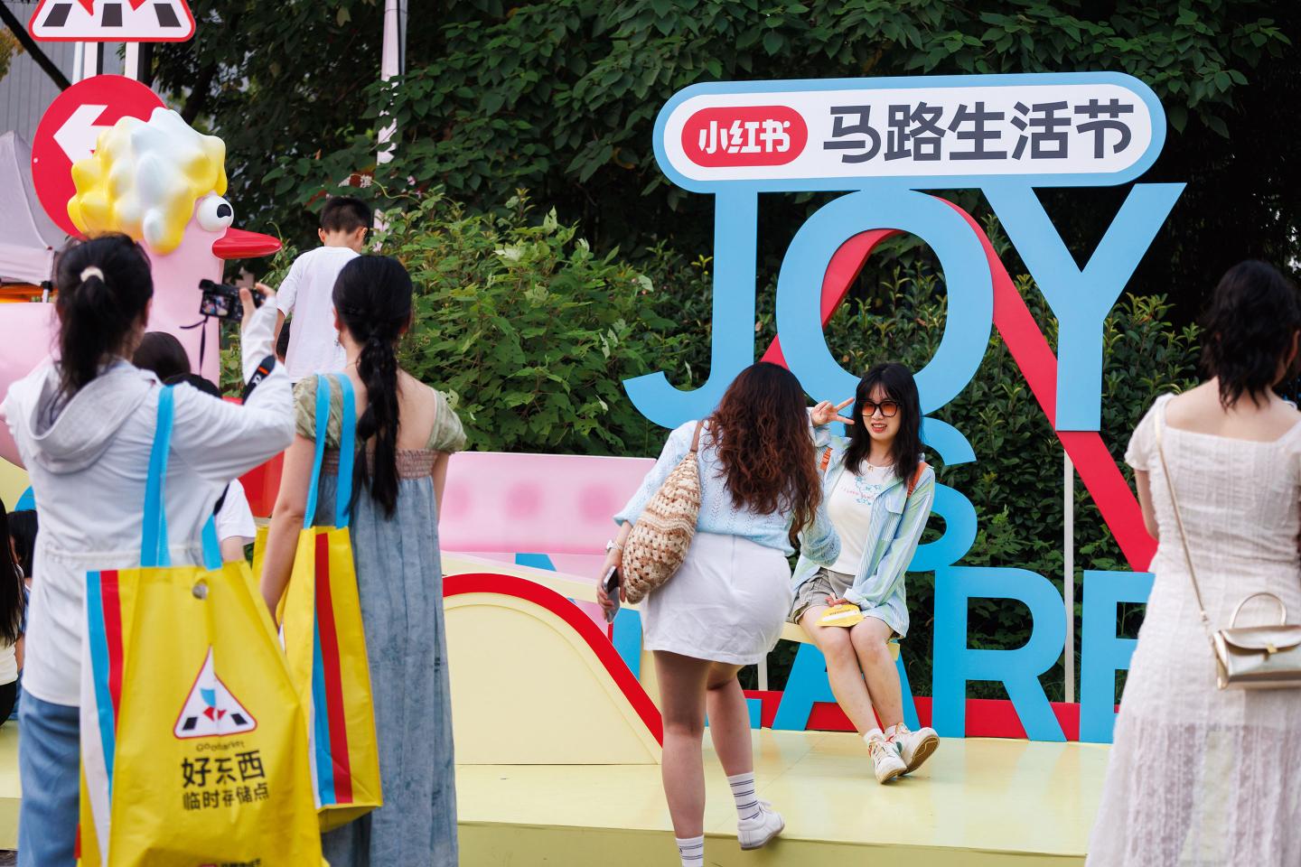 Tourists pose for a picture in Shanghai, China