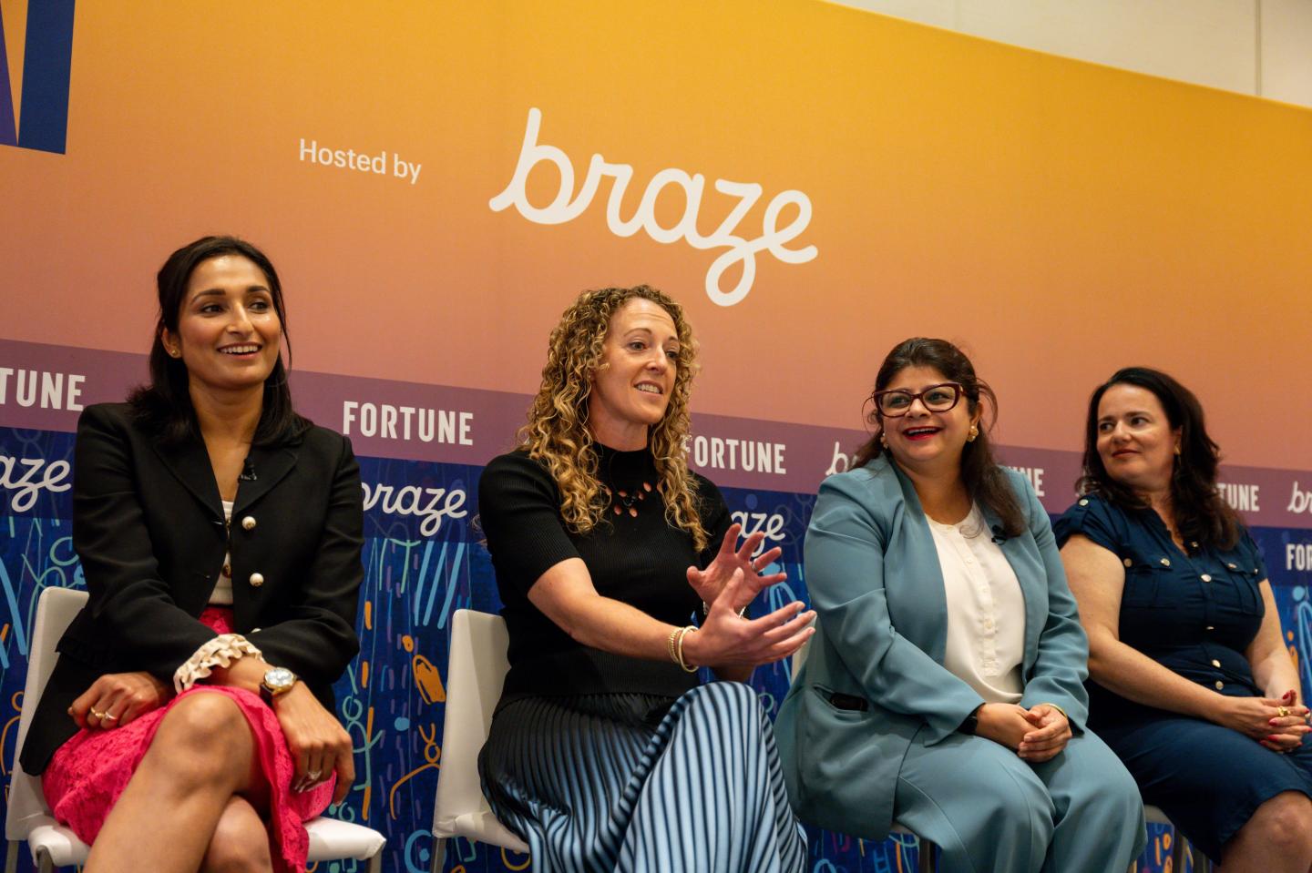 From left to right: Astha Malik of Braze, Amy Brooks of the NBA, Ekta Chopra of e.l.f., and Irana Wasti of BILL. All sit on stage during a conference panel