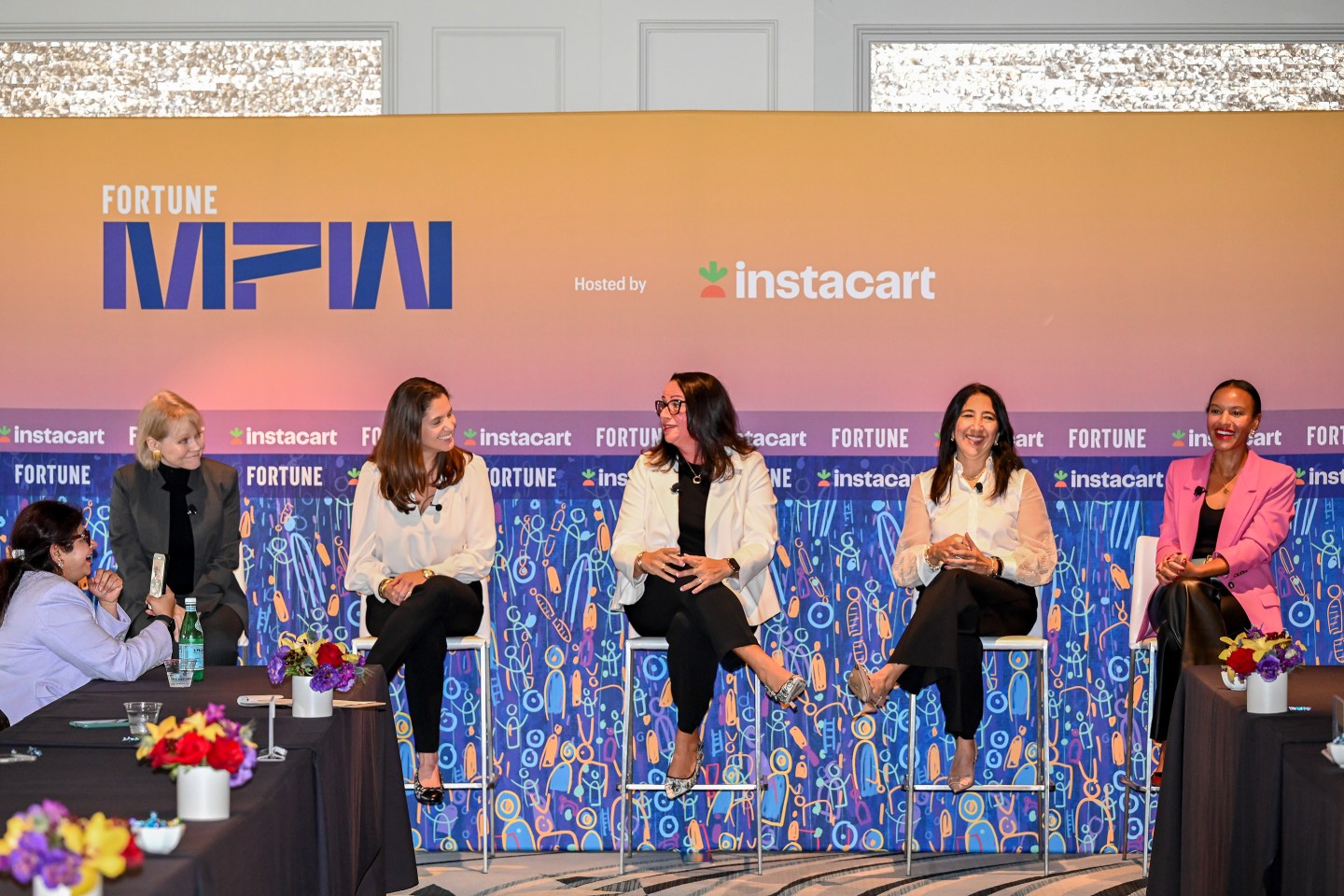 4 women sitting onstage