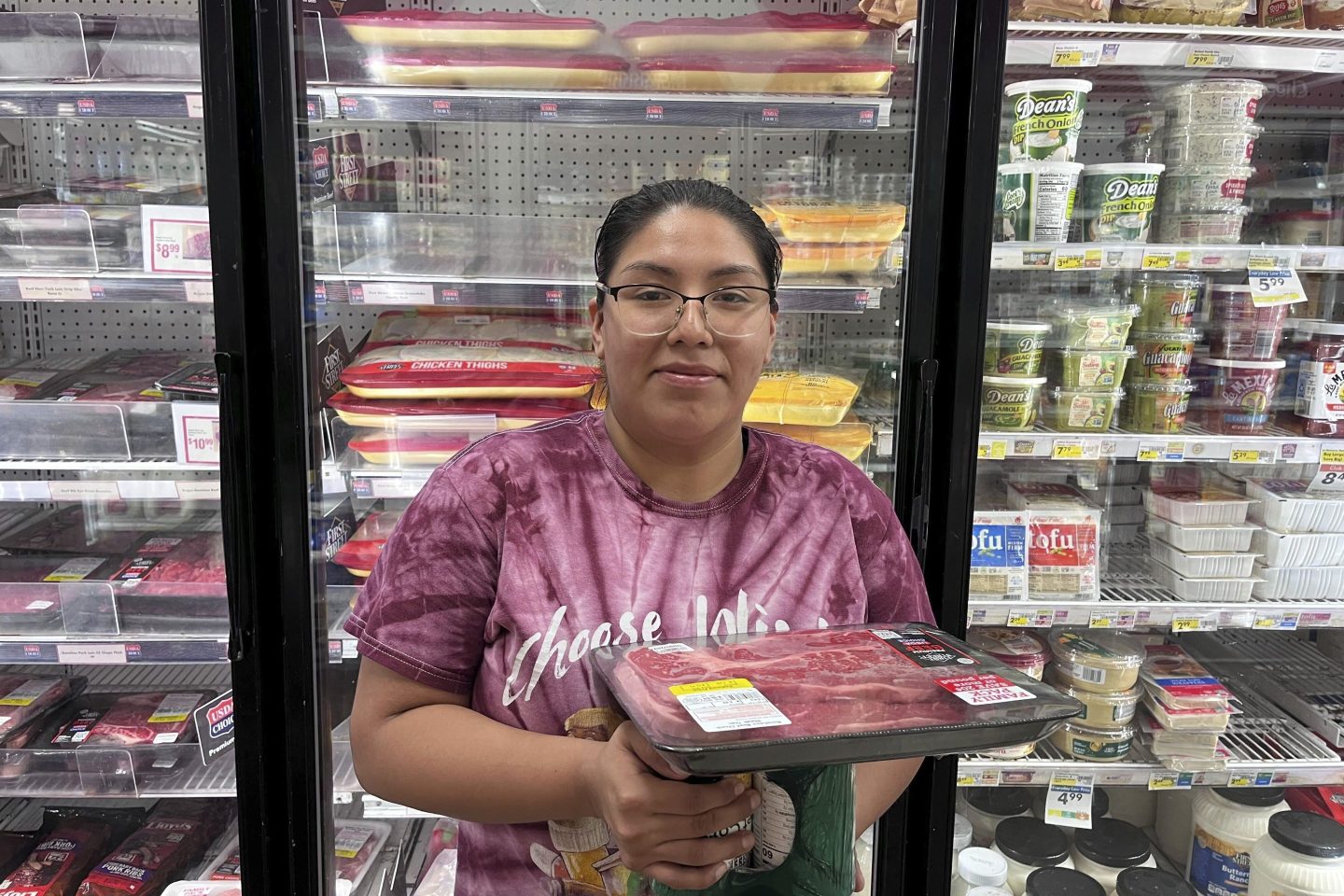 Jasmine Acosta, 23, in front of the meat aisle at a Smart & Final grocery store in Los Angeles.