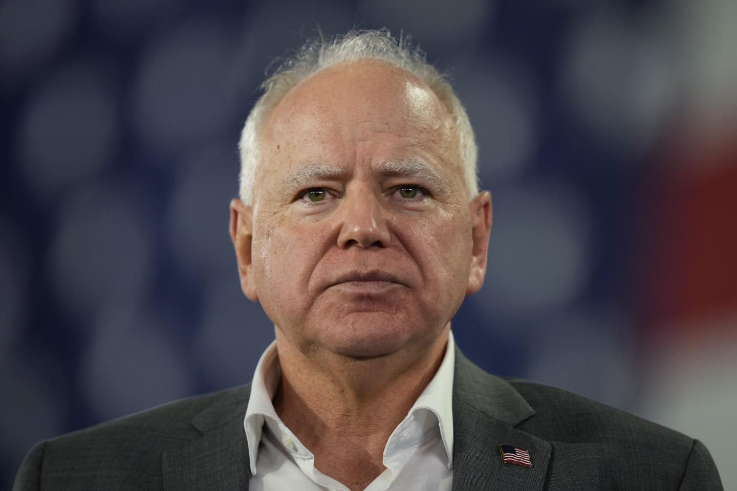 Vice presidential candidate Tim Walz stares directly into the camera