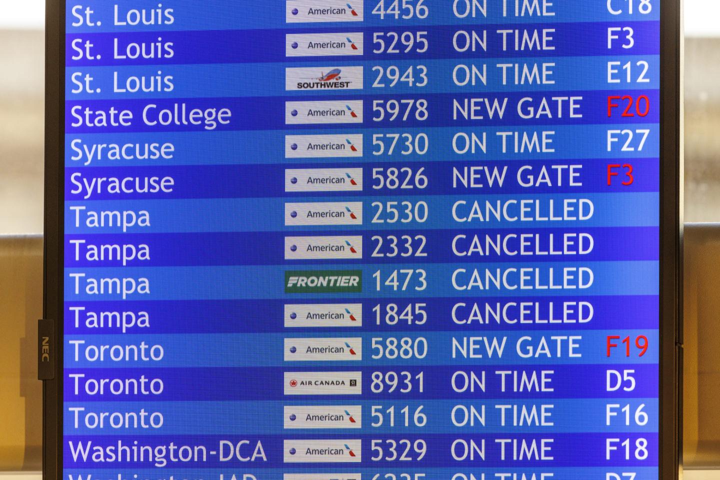 Flight information board with cancelled flights to Tampa is shown on Wednesday, Oct. 9, 2024 at the Philadelphia International Airport.