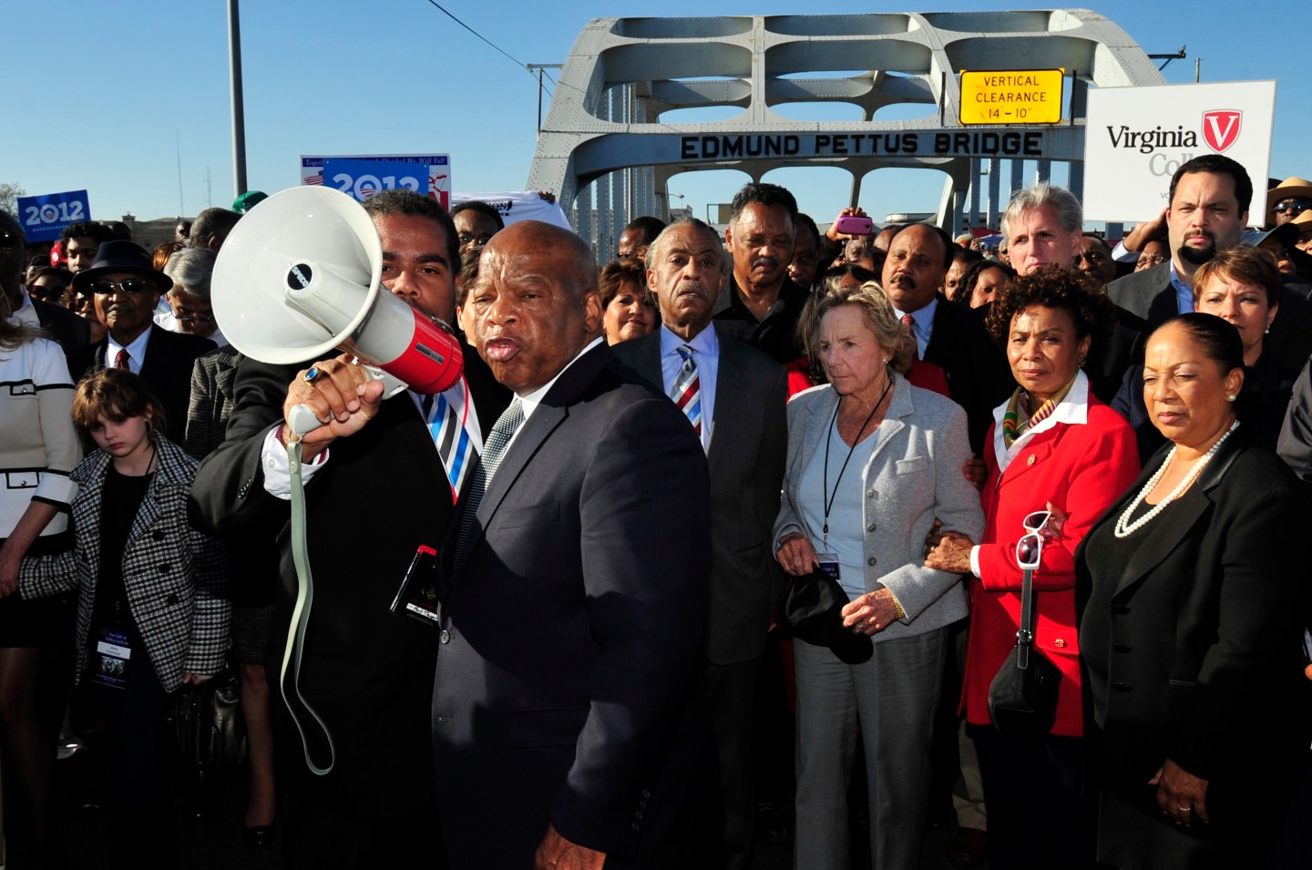 U.S. Rep. John Lewis, D-Ga., center, talks with those gathered, including Ethel Kennedy, center, and Rev. Jesse Jackson, on the historic Edmund Pettus Bridge during the 19th annual reenactment of the "Bloody Sunday" Selma to Montgomery civil rights march across the bridge in Selma, Ala., Sunday, March 4, 2012, 47 years after the historic march that led to the Voting Rights Act.