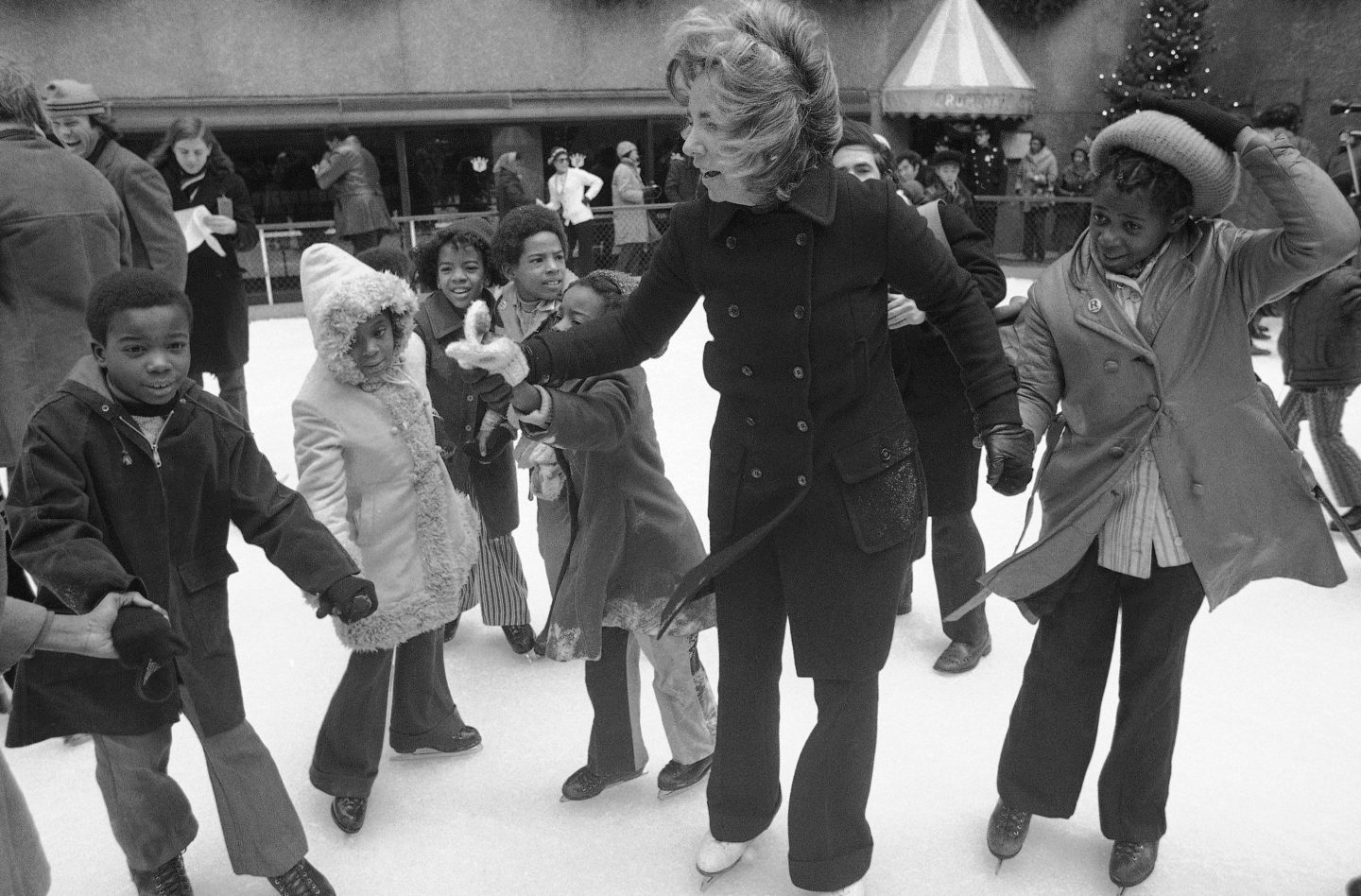 Ethel Kennedy, widow of Sen. Robert Kennedy, ice skates with youngsters from Bedford Stuyvesant, Brooklyn borough, at the eighth annual Kennedy skating party originated by the late senator at Rockefeller Center's skating rink on Dec. 16, 1972, in New York.
