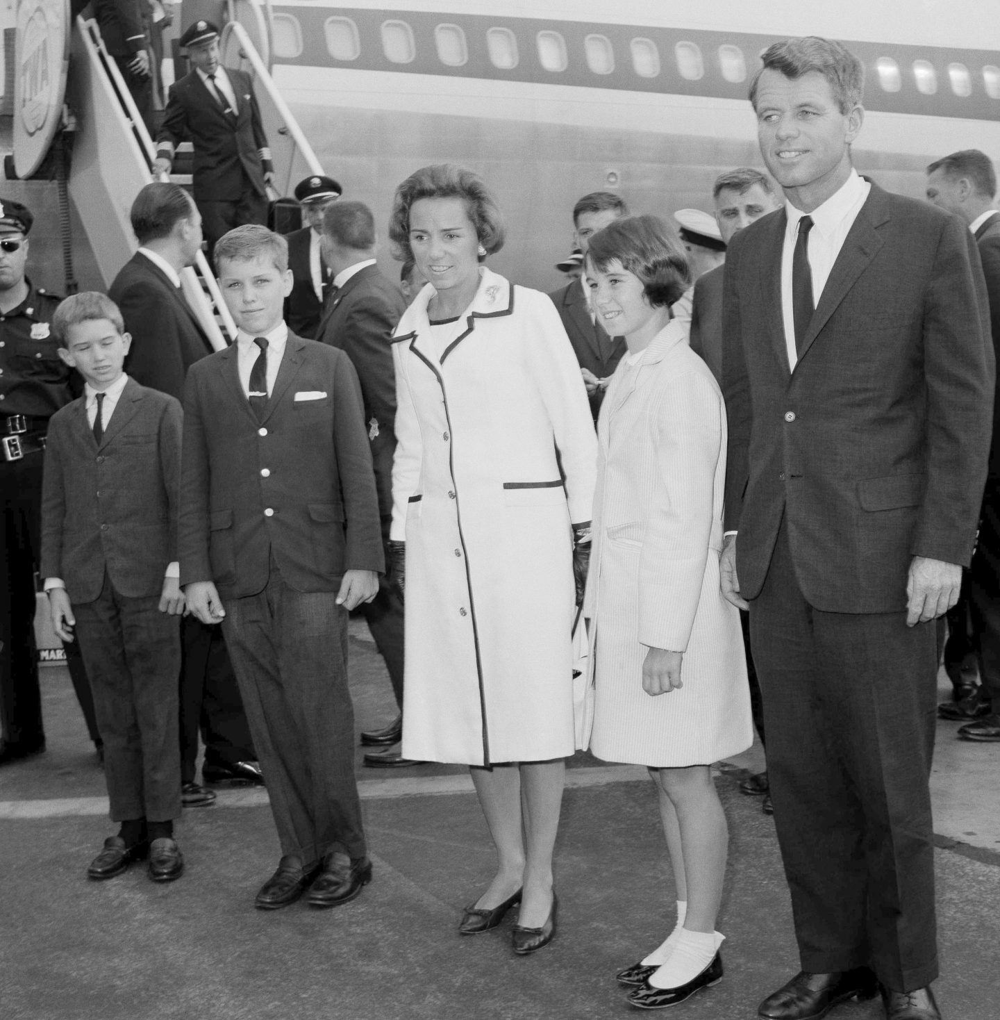 Attorney General Robert F. Kennedy, right, wife Ethel Kennedy, and children, from left, Bobby, Joseph, and Kathleen, second right, pose at Kennedy International Airport in New York, July 1, 1964, shortly after they returned from a one-week trip to West Germany and Poland.