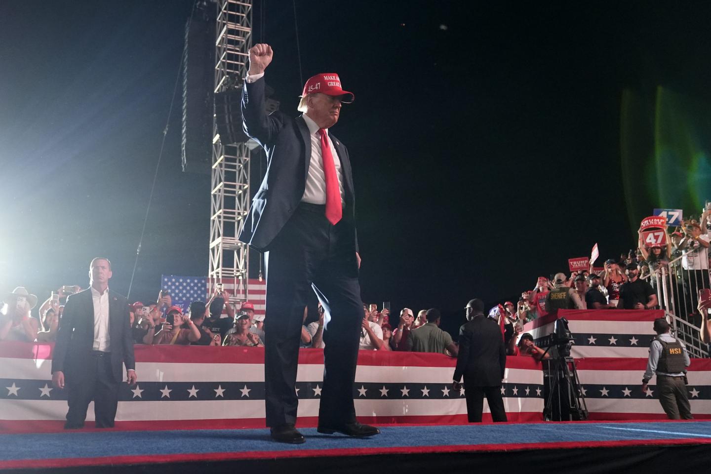 Donald Trump gestures to the audience