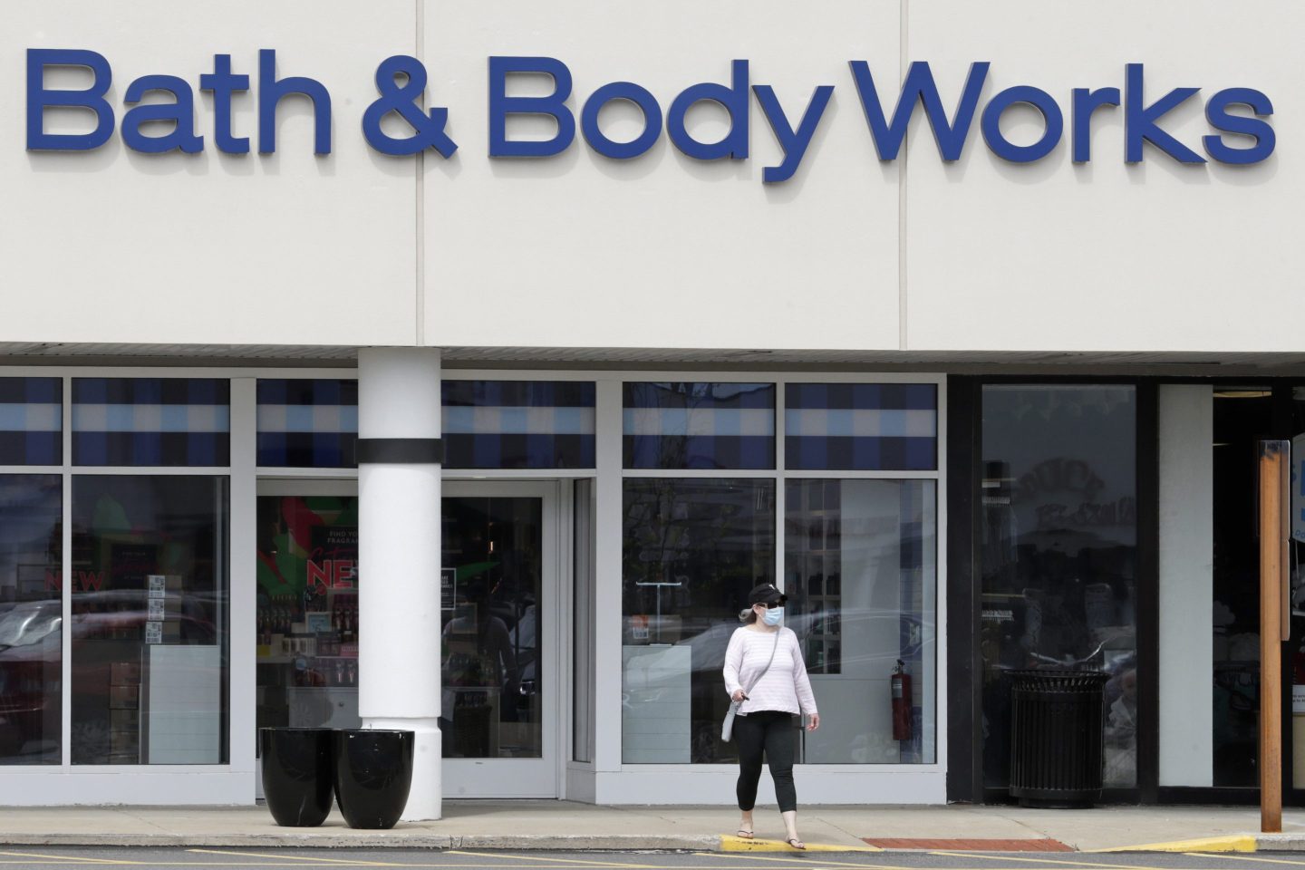 The logo and exterior of a Bath & Body Works store is seen from the street.