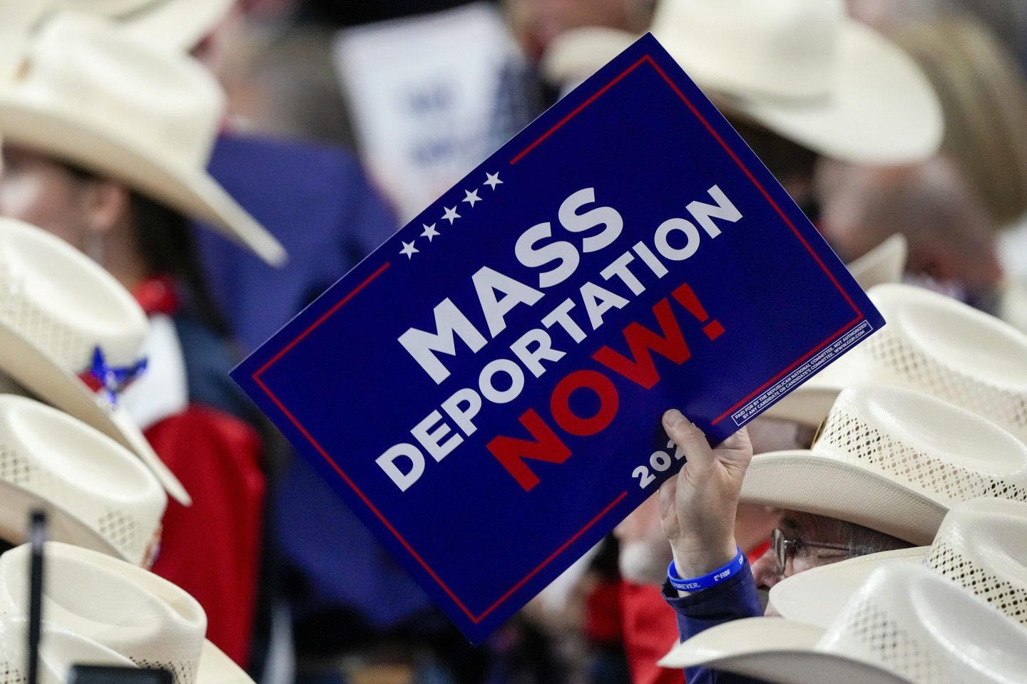 A member of the Texas delegation holds a sign during the Republican National Convention on July 17, 2024, in Milwaukee.