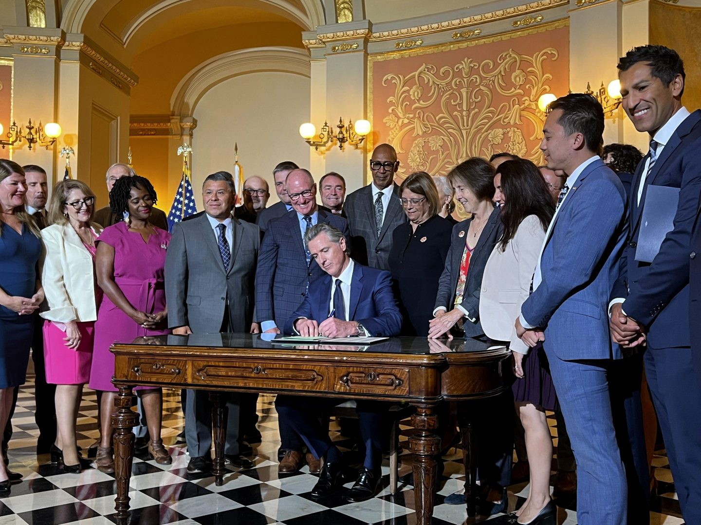California Gov. Gavin Newsom signs legislation at the state Capitol on Oct. 14, 2024, aimed at preventing gas prices from spiking at the pump.
