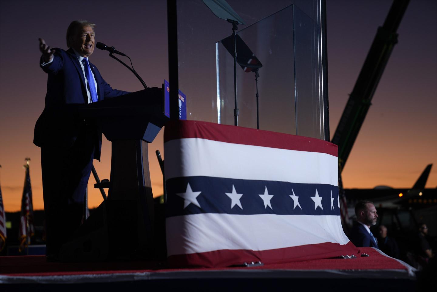 Donald Trump speaks on stage