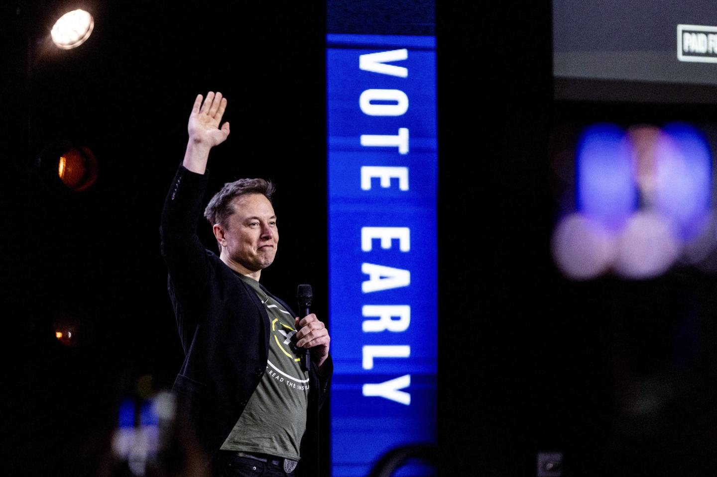 Elon Musk waves
