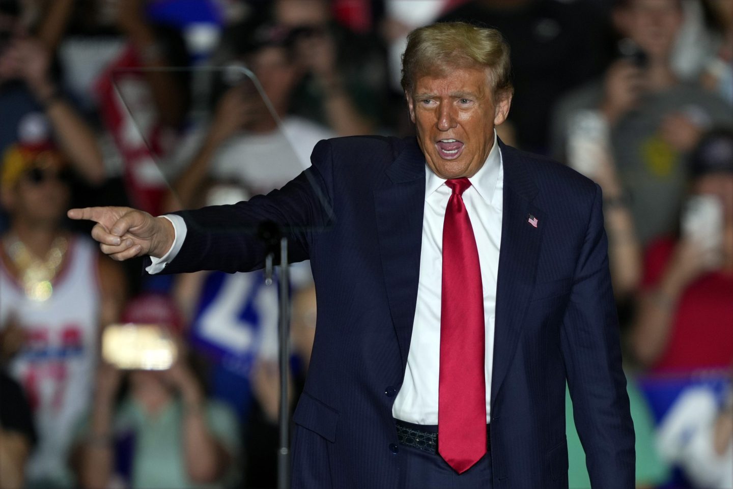 Republican presidential nominee former President Donald Trump gestures to supporters at a campaign rally at Greensboro Coliseum, on Oct. 22, 2024, in Greensboro, N.C.