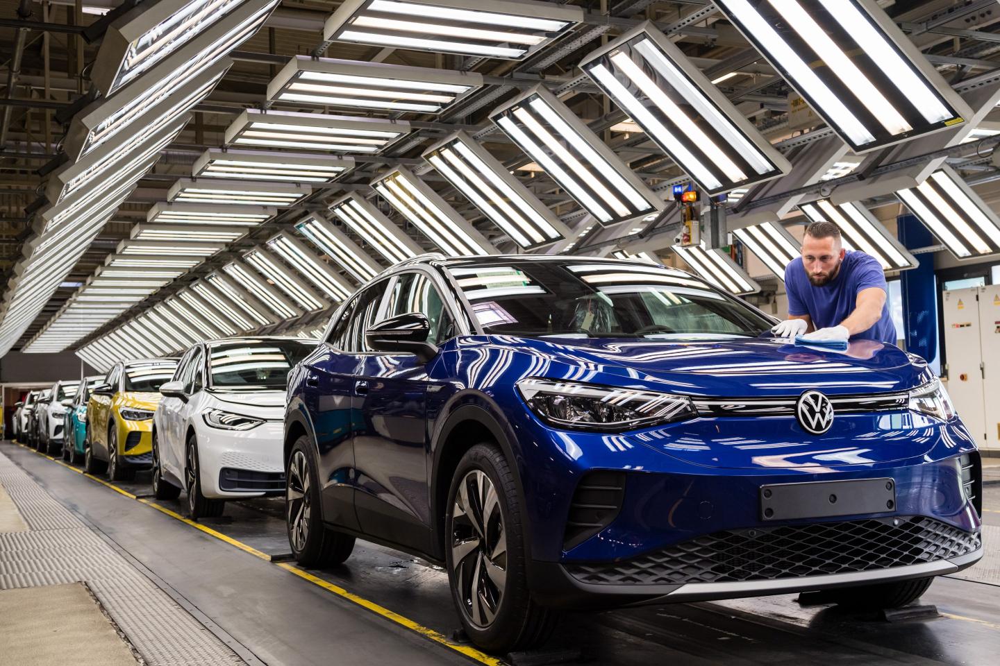Workers assemble the new Volkswagen ID.4 electric sport utility vehicle (SUV) at the VW factory on September 18, 2020 in Zwickau, Germany. Volkswagen will officially present the ID.4 towards the end of September. In addition, Volkswagen also produces the smaller ID.3 at the Zwickau plant. Both cars are meant to lead the company towards mass sales in the electric car market and provide it with strong competition against rival Tesla.