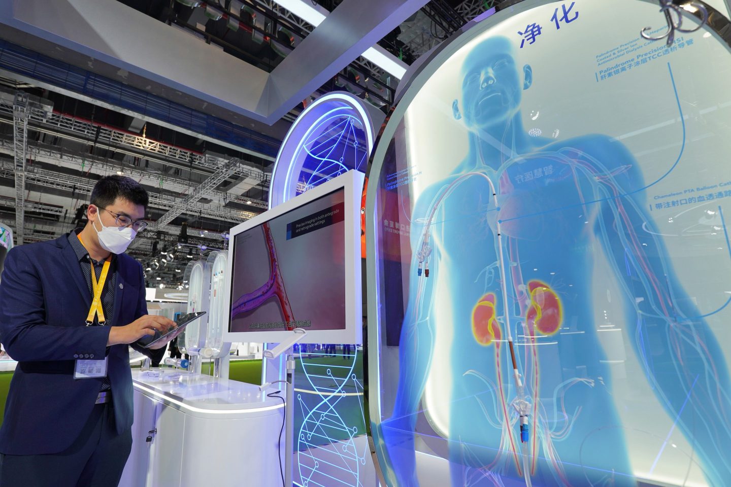 An exhibitor demonstrate the dialysis equipment on the booh of Medtronic