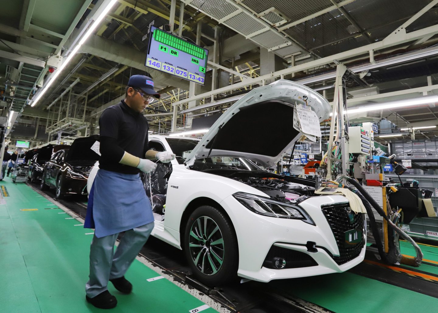 A worker assembles auto parts at Toyota’s Motomachi plant in Toyota City.