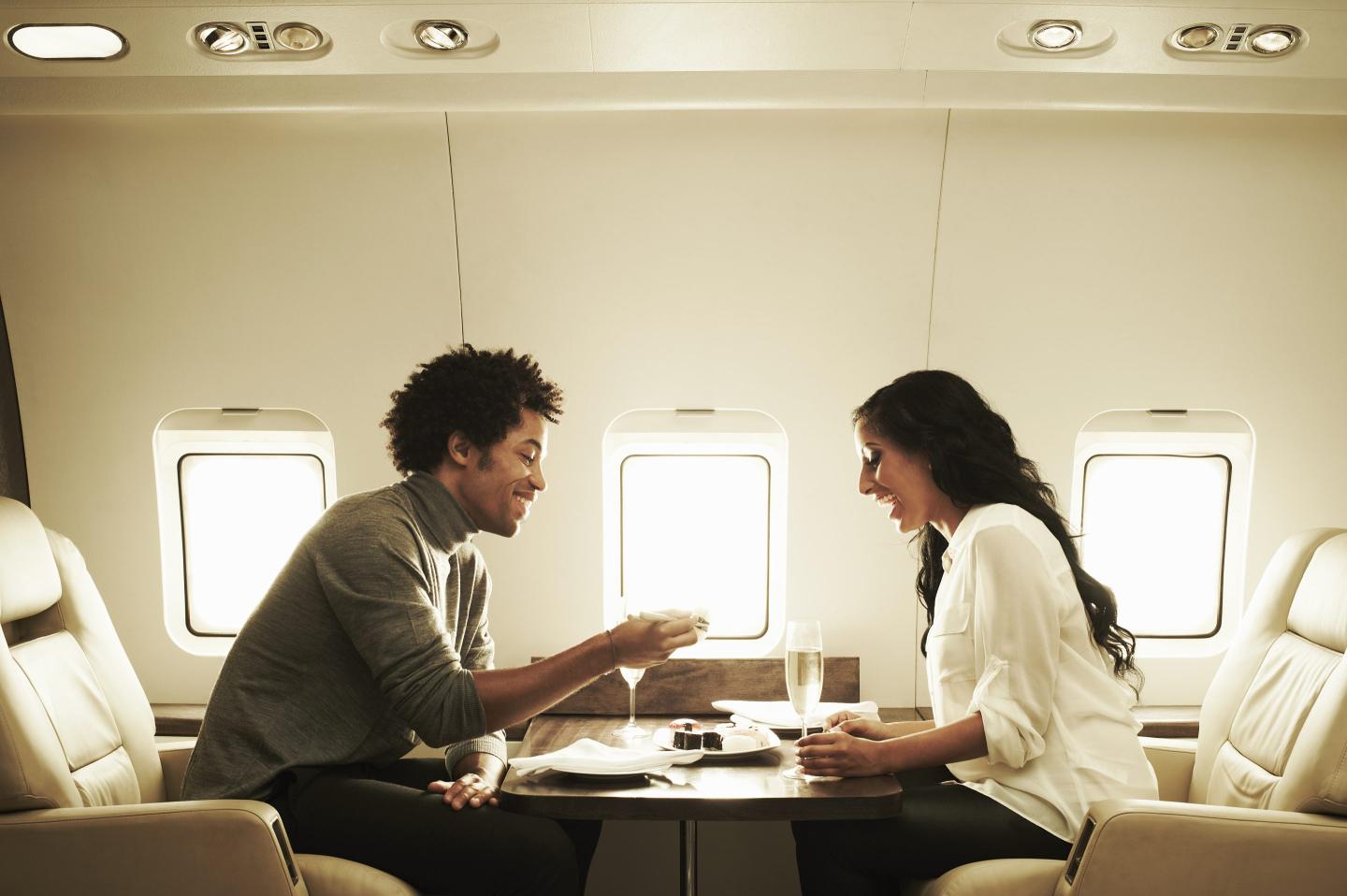 A wealthy couple on board a private jet