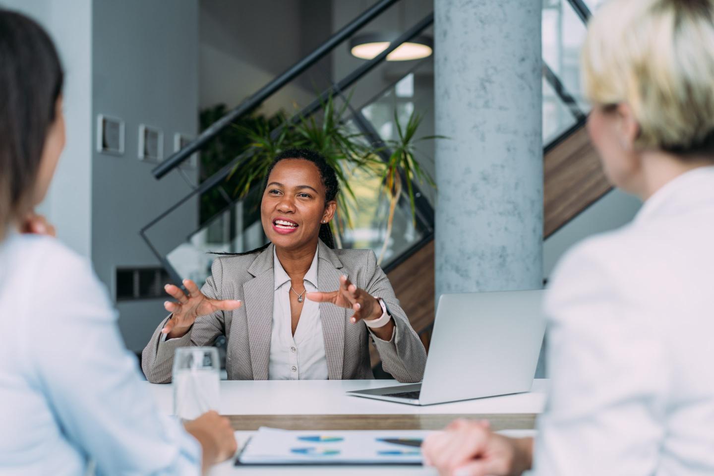 HR leader talks with executives.