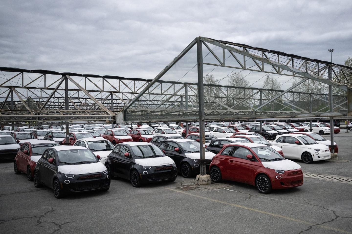 Fiat 500 are parked at the Mirafiori Stellantis' factory in Turin, on April 10, 2024. To meet the growing demand for electrified vehicles and the ambitious targets presented in the Dare Forward 2030 strategic plan, Stellantis and its joint venture partner, Punch Powertrain, signed a new agreement increasing production of the future-generation electrified dual-clutch transmissions (eDCT) for Stellantis hybrid and plug-in hybrid electric vehicles (PHEV).