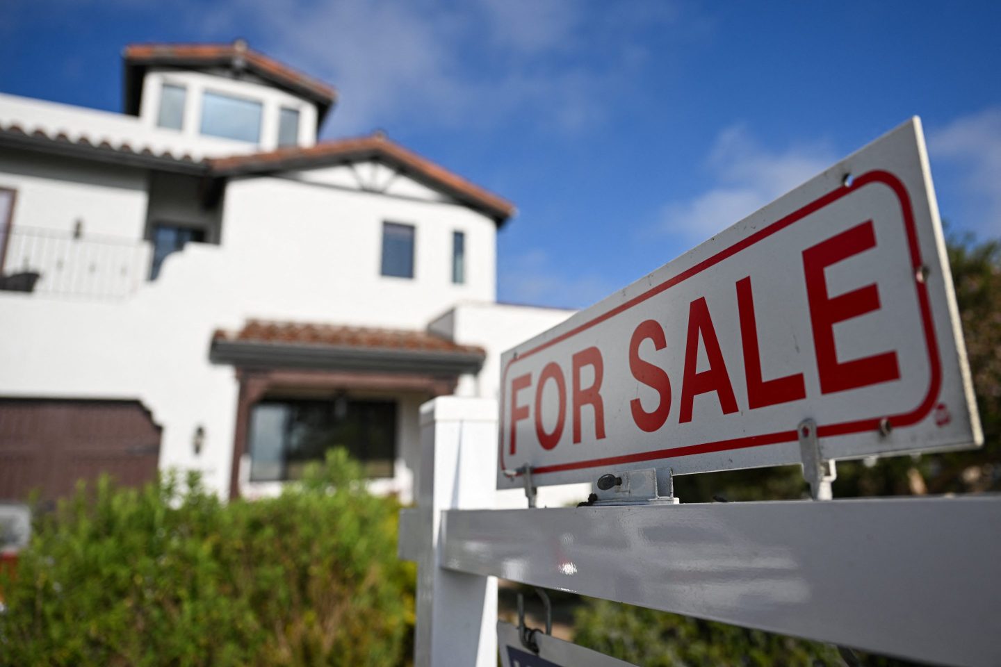 A for sale sign is displayed outside of a home for sale on August 16, 2024 in Los Angeles, California.
