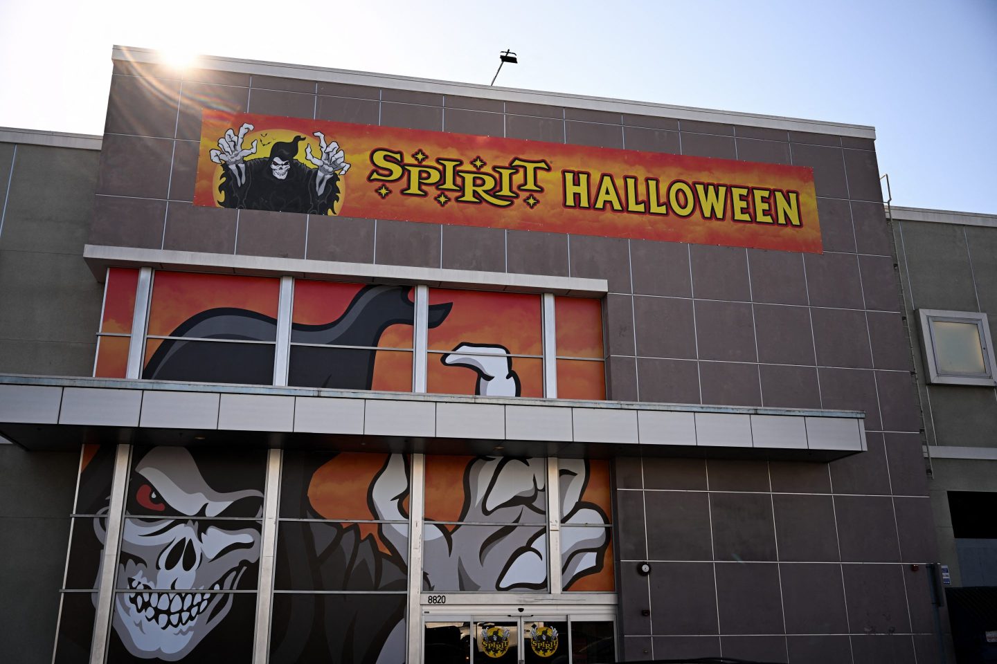 The "Jack The Reaper" logo displayed in the windows of a Spirit Halloween seasonal holiday store in the location of a closed former Bed Bath and Beyond retail store.