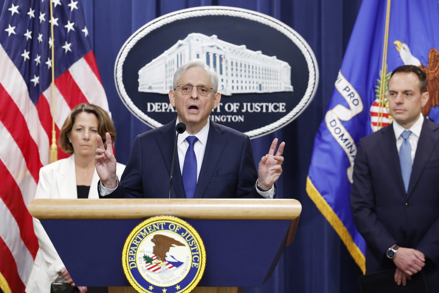 U.S. Attorney General Merrick Garland (C) speaks alongside U.S. Deputy Attorney General Lisa Monaco (L) and Principal Deputy Associate Attorney General Benjamin Mizer (R) during a press conference at the U.S. Department of Justice on August 23, 2024 in Washington, DC.