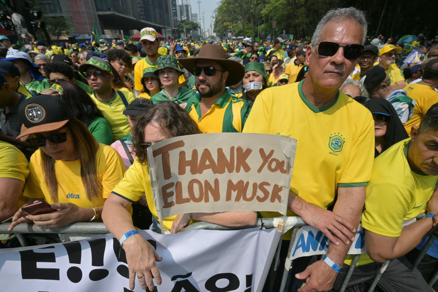 Supporters of former Brazilian President Jair Bolsonaro hold a sign thanking X social media platform owner Elon Musk, during an Independence day rally in Sao Paulo, Brazil on Sept. 7, 2024.