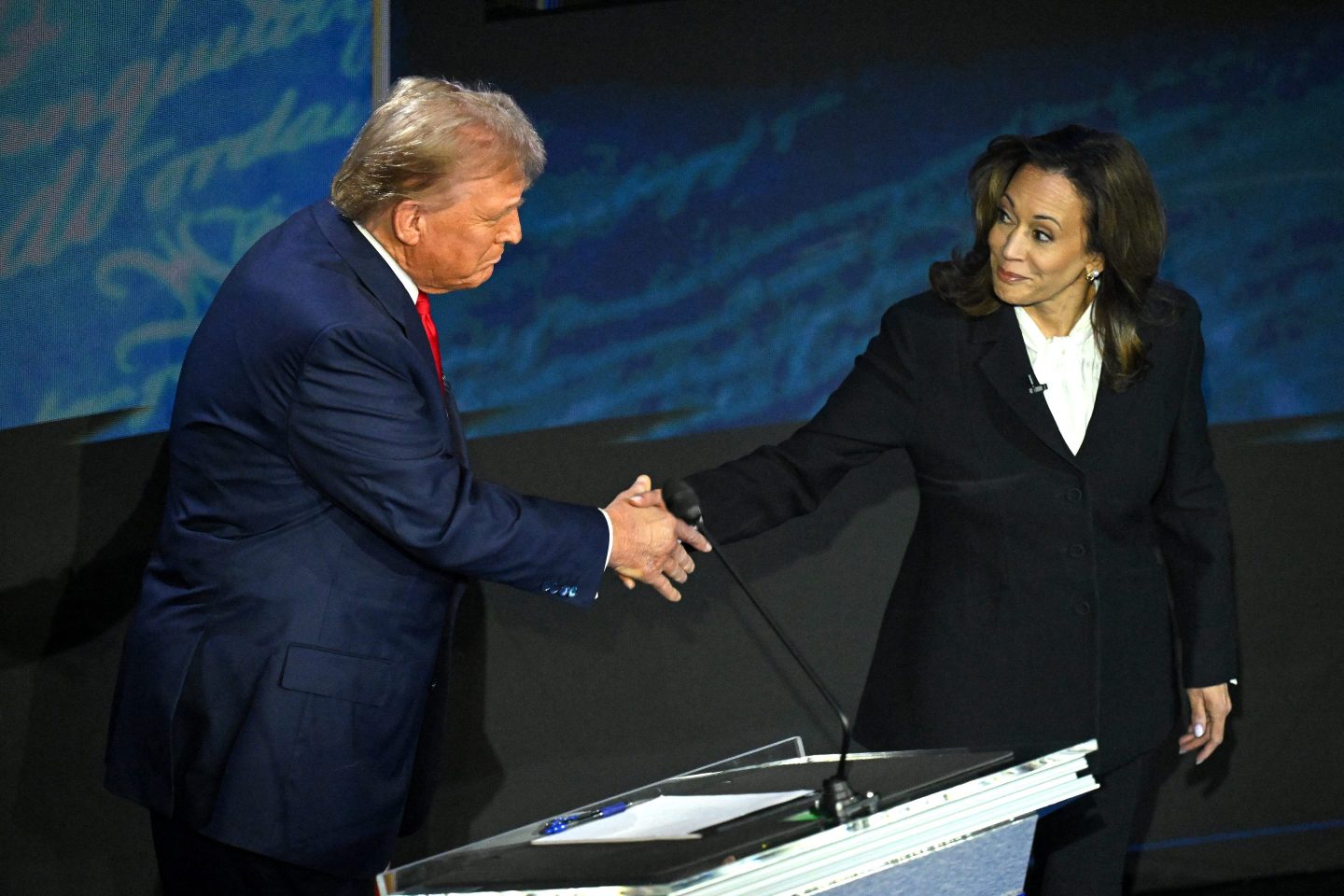 Kamala Harris and Donald Trump shake hands on the debate stage