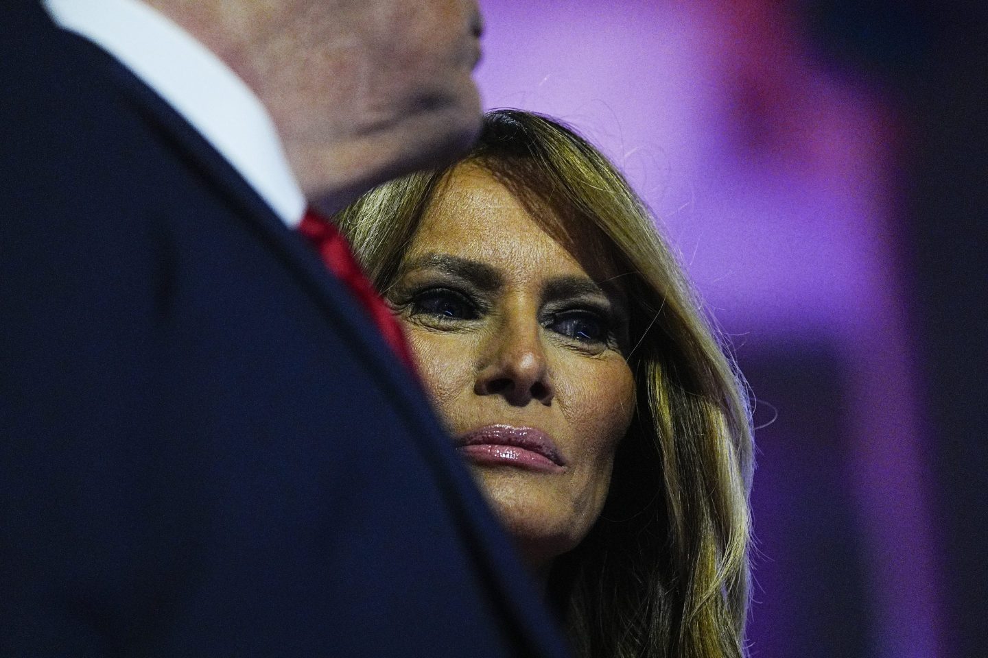 Melania Trump looks demure next to Donald Trump