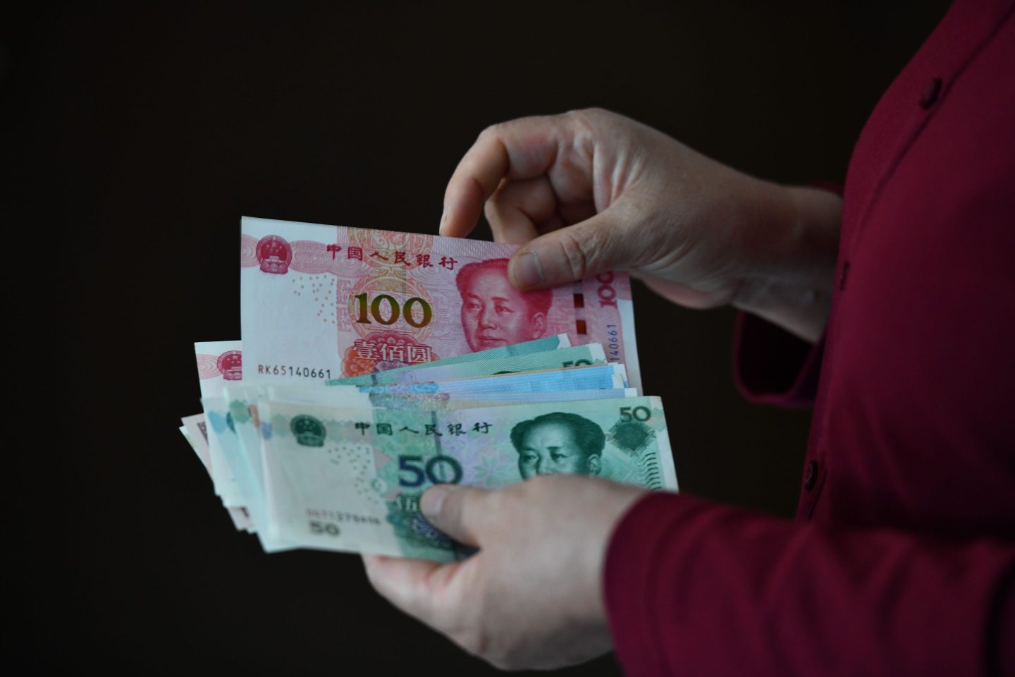 Chinese yuan banknotes pictured in Fuyang on Sept. 24, 2024, after China’s central bank announced it was cutting the amount of money banks needed to hold in reserve.