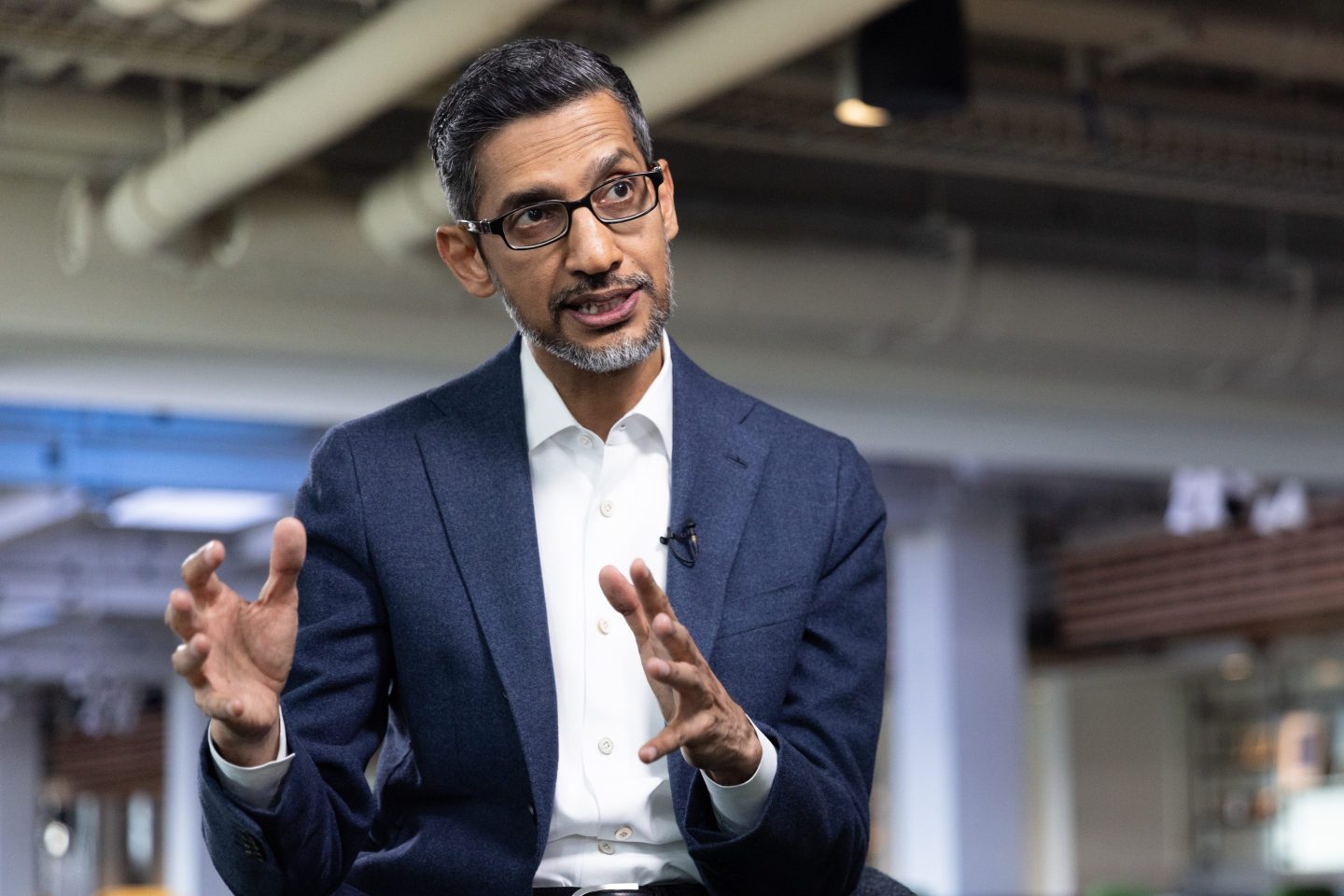 Alphabet CEO Sundar Pichai moves his hands as he talks during an interview