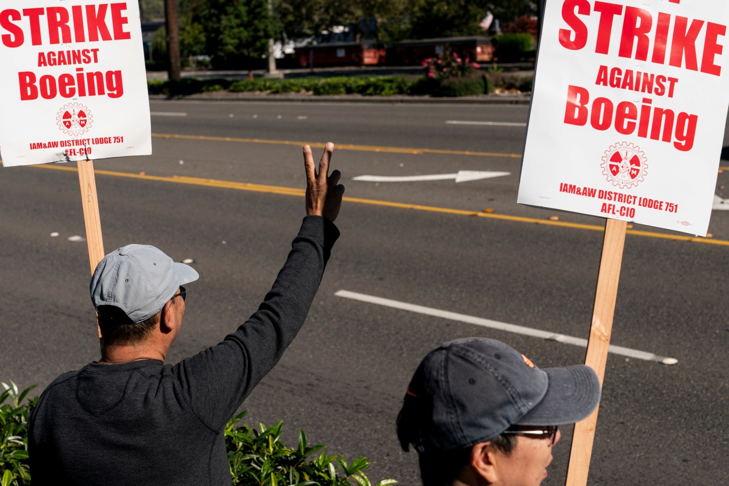Workers picket outside the Boeing manufacturing facility during a strike in Renton, Wash, on Oct. 3, 2024.