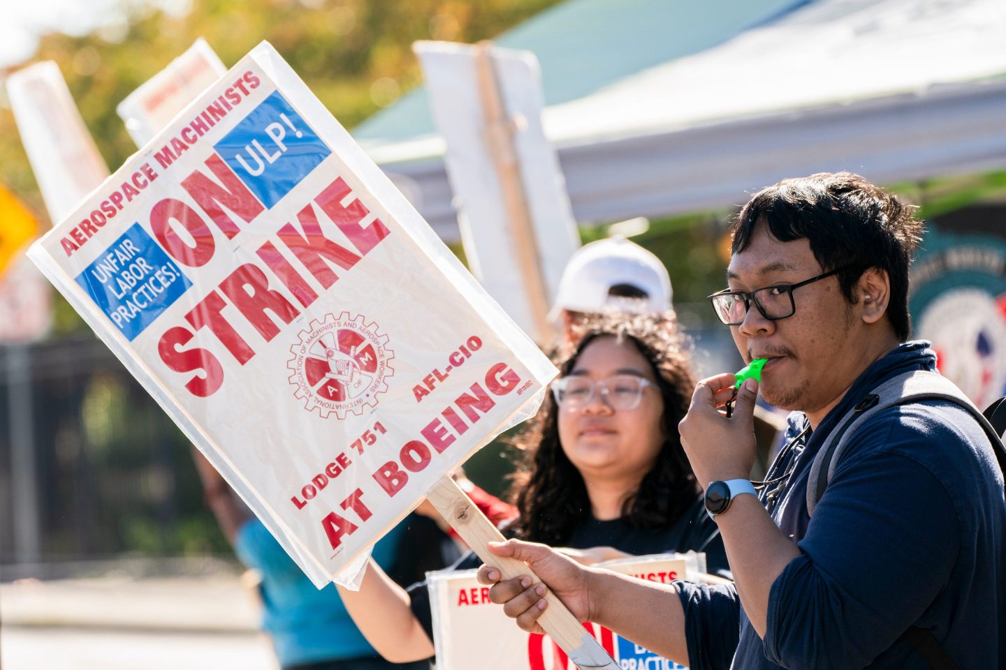 Workers picket outside the Boeing Co. manufacturing facility during a strike in Renton, Wash., on Oct. 3, 2024.
