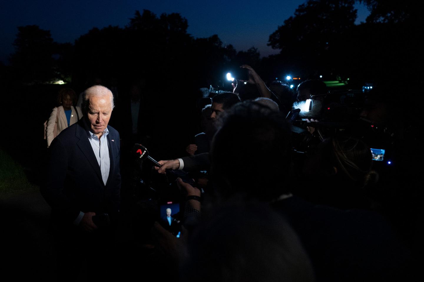 Biden speaks to a group of reporters