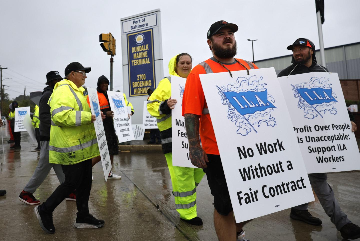 Longshoremen with the International Longshoremen’s Association (ILA) and their supporters picket outside of the Dundalk Marine Terminal at the Port of Baltimore.