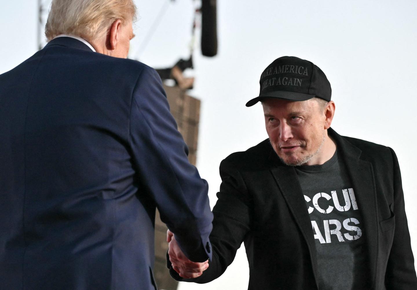 Musk and Trump shake hands