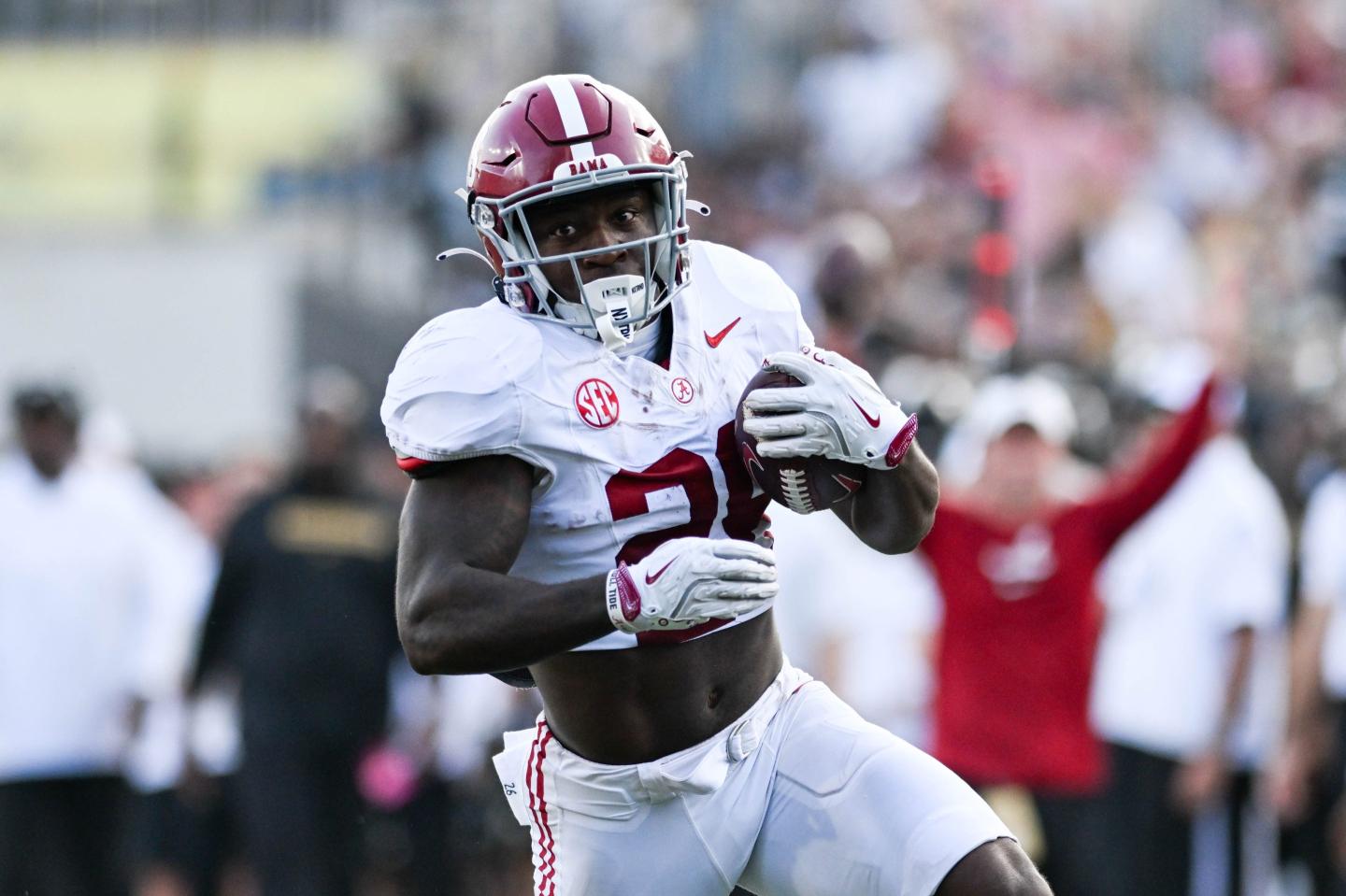 An Alabama Crimson Tide running back runs the ball against Vanderbilt
