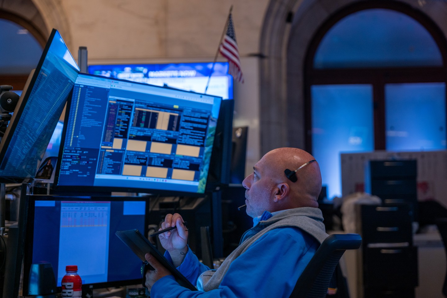 Traders and others work on the New York Stock Exchange floor