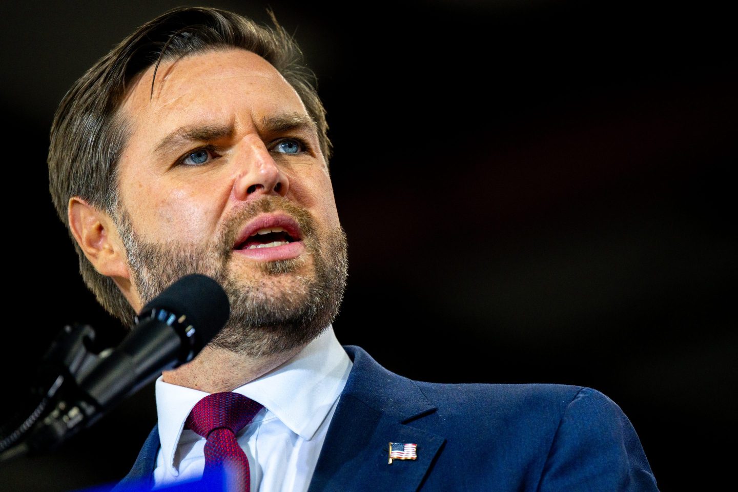 J.D. Vance speaks into microphone