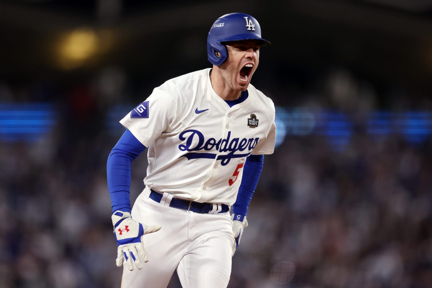 Freddie Freeman #5 of the Los Angeles Dodgers celebrates after hitting a walk-off grand slam in Game 1.