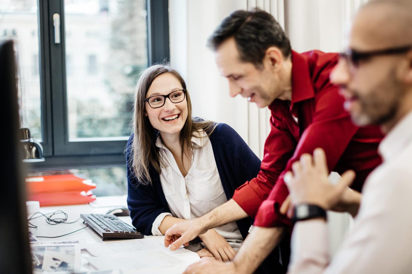 Happy workers at office.