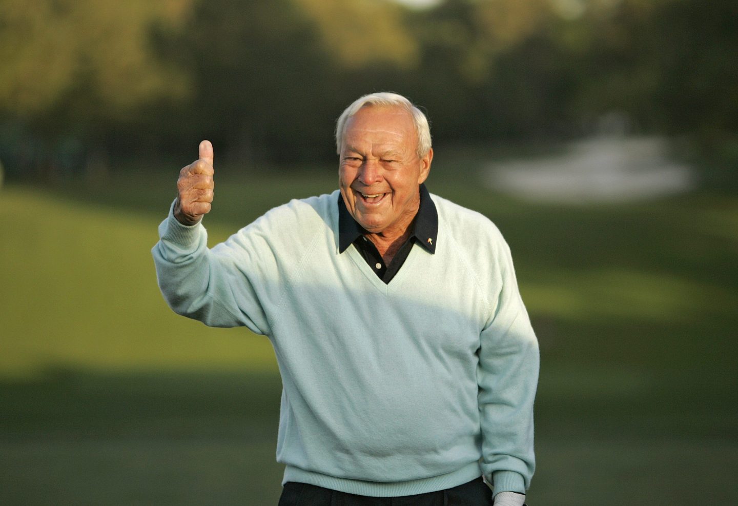 Arnold Palmer hits the ceremonial first tee shot
