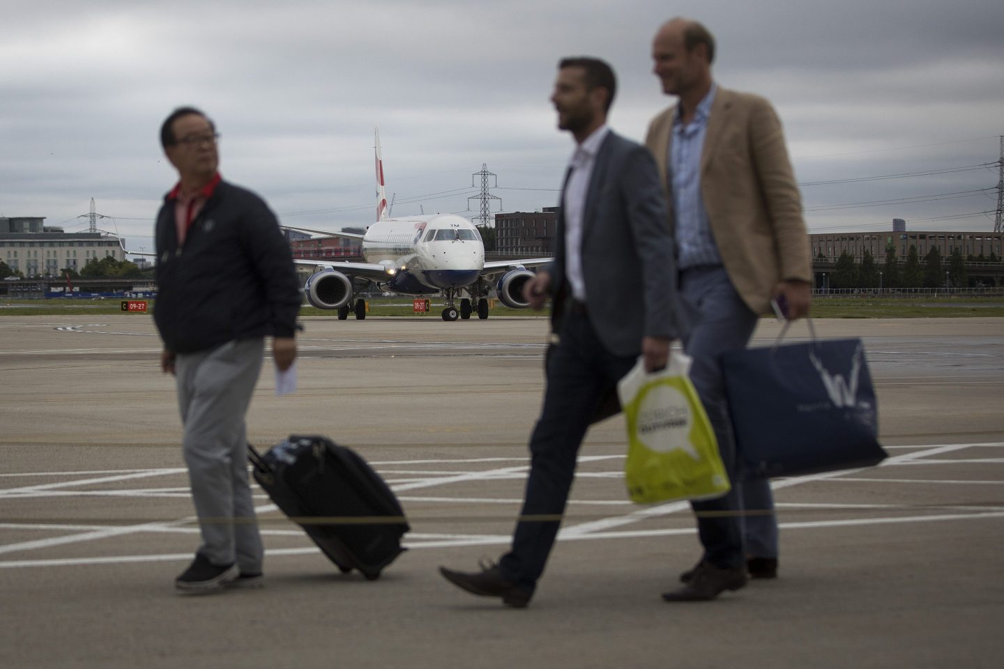 passengers getting off an airplane