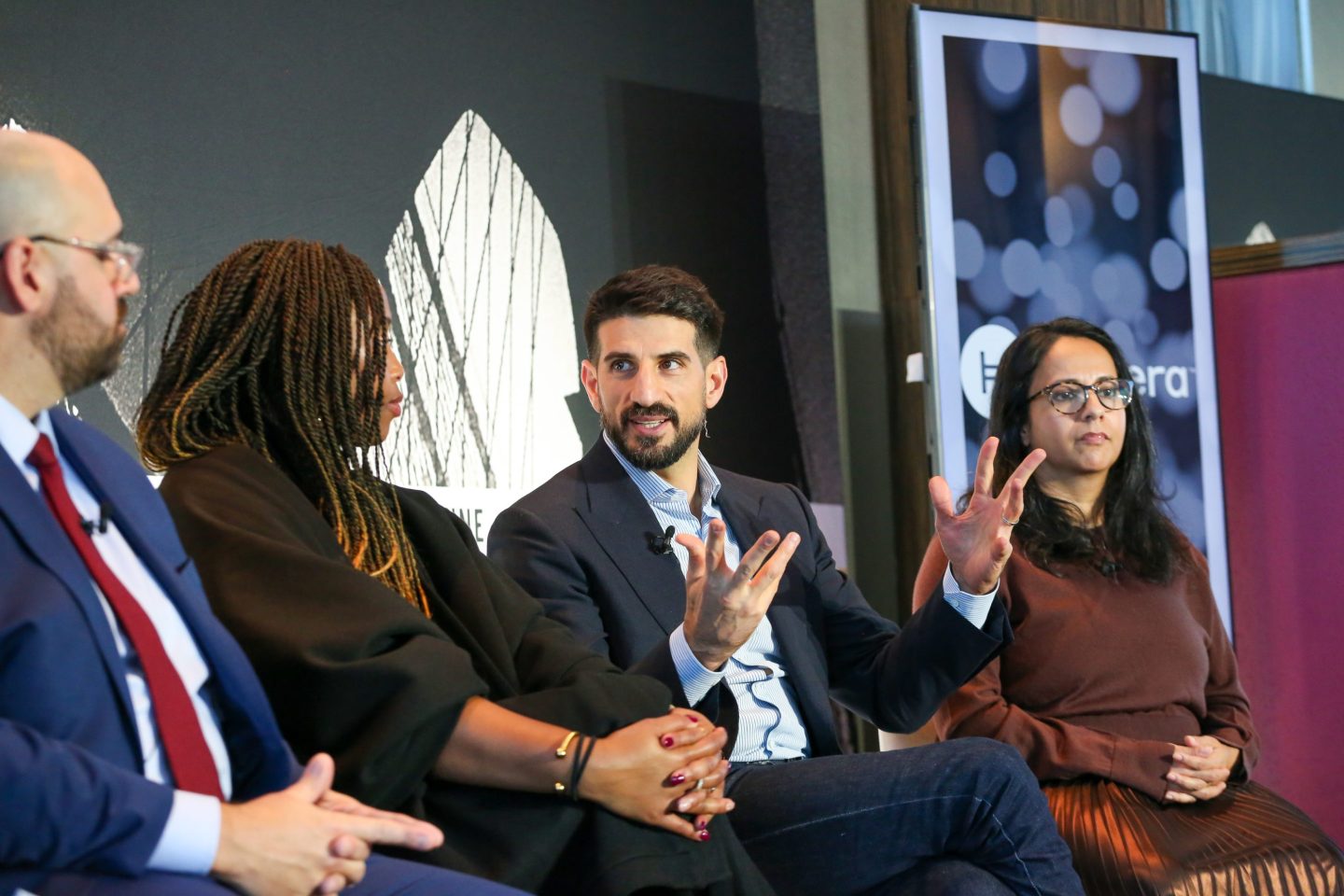Paxos CEO Charles Cascarilla speaks at Fortune's Global Forum next to a handful of leaders in the decentralized finance space
