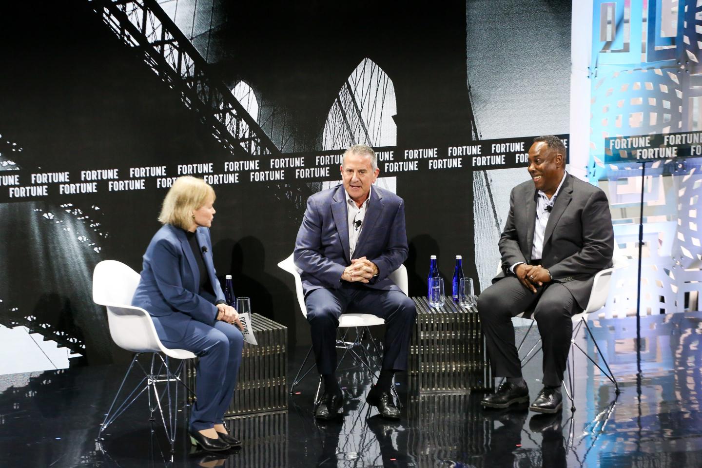 Diane Brady, Brian Cornell, and Steven Williams sit on stage and speak with one another.