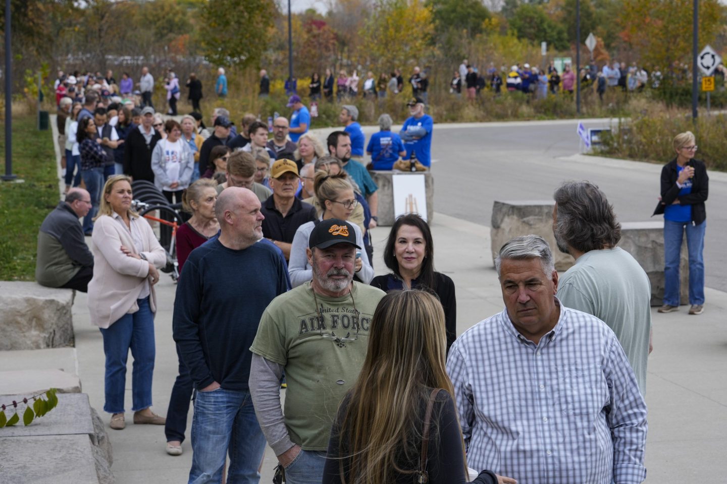 Voters line up to vote as a early voting location opened in Carmel, Ind., on Oct. 23, 2024.