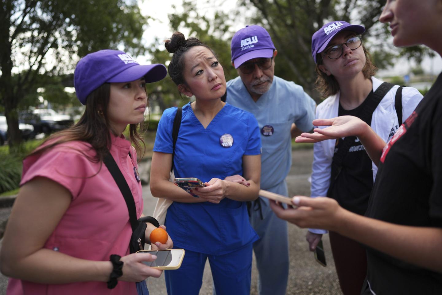 Doctors canvassing Florida talk to each other before going door to door
