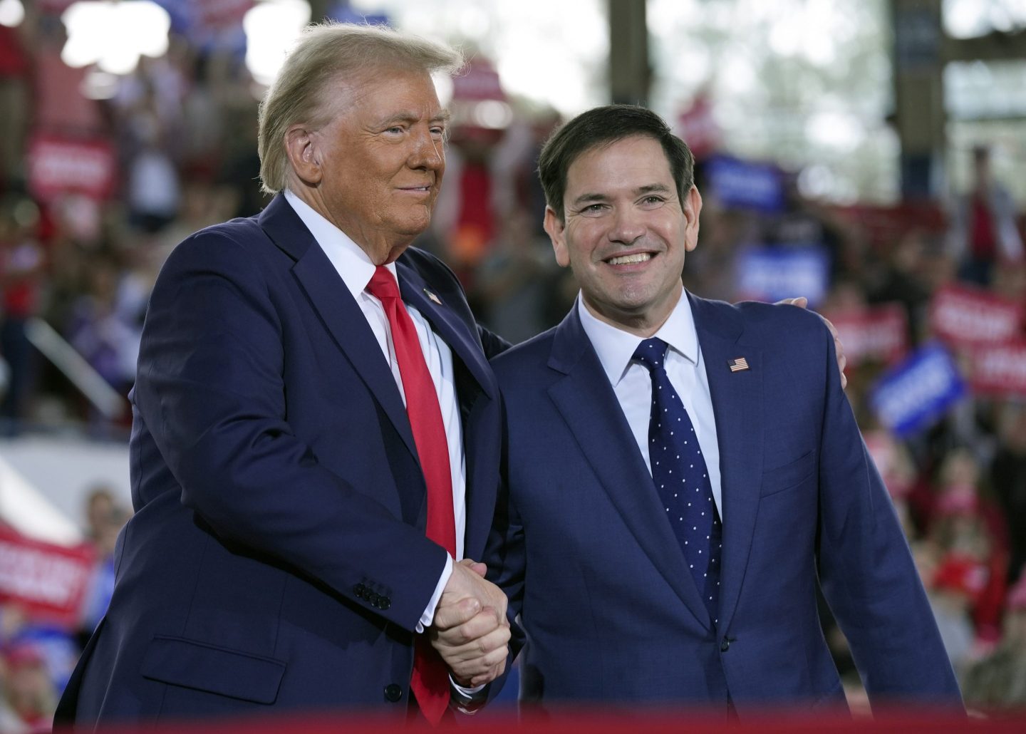 Republican presidential nominee former President Donald Trump greets Sen. Marco Rubio, R-Fla., during a campaign rally at J.S. Dorton Arena, Nov. 4, 2024, in Raleigh, N.C.