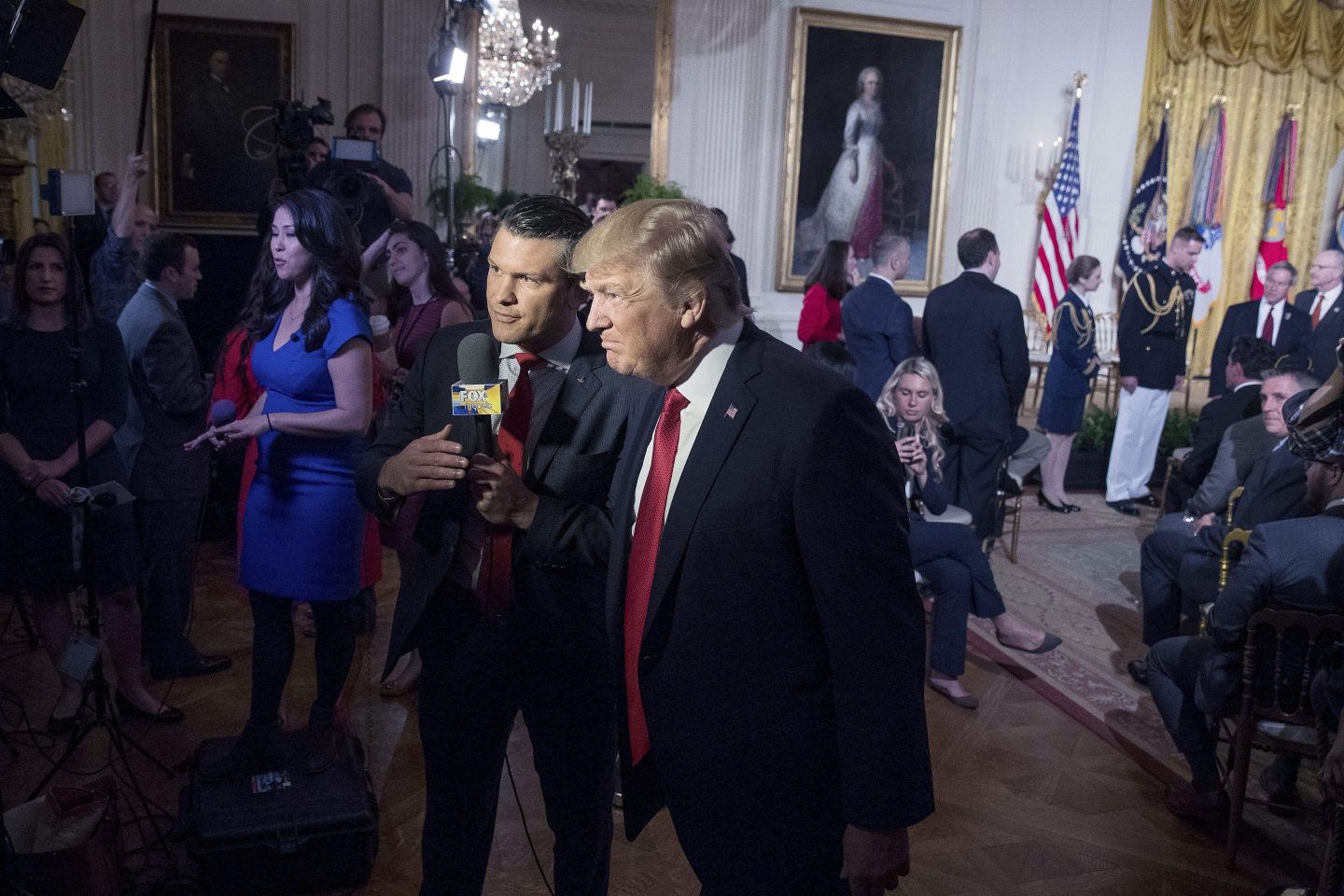 President Donald Trump appears with Fox & Friends co-host Pete Hegseth at a Wounded Warrior Project Soldier Ride event in the East Room of the White House in Washington, on April 6, 2017.